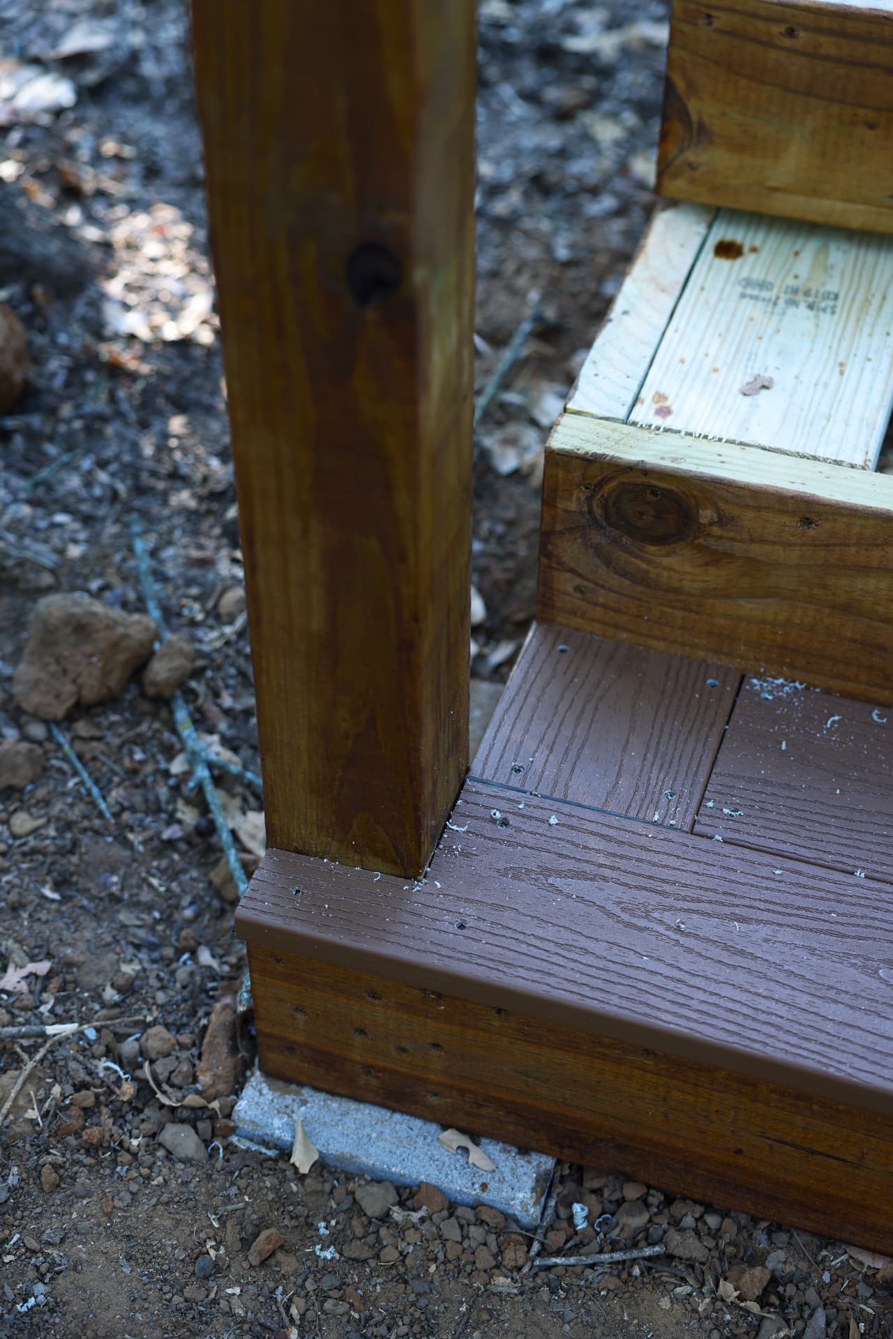 Composite stair tread and fascia wrapping the stair box on Greg's Grandview, TX deck