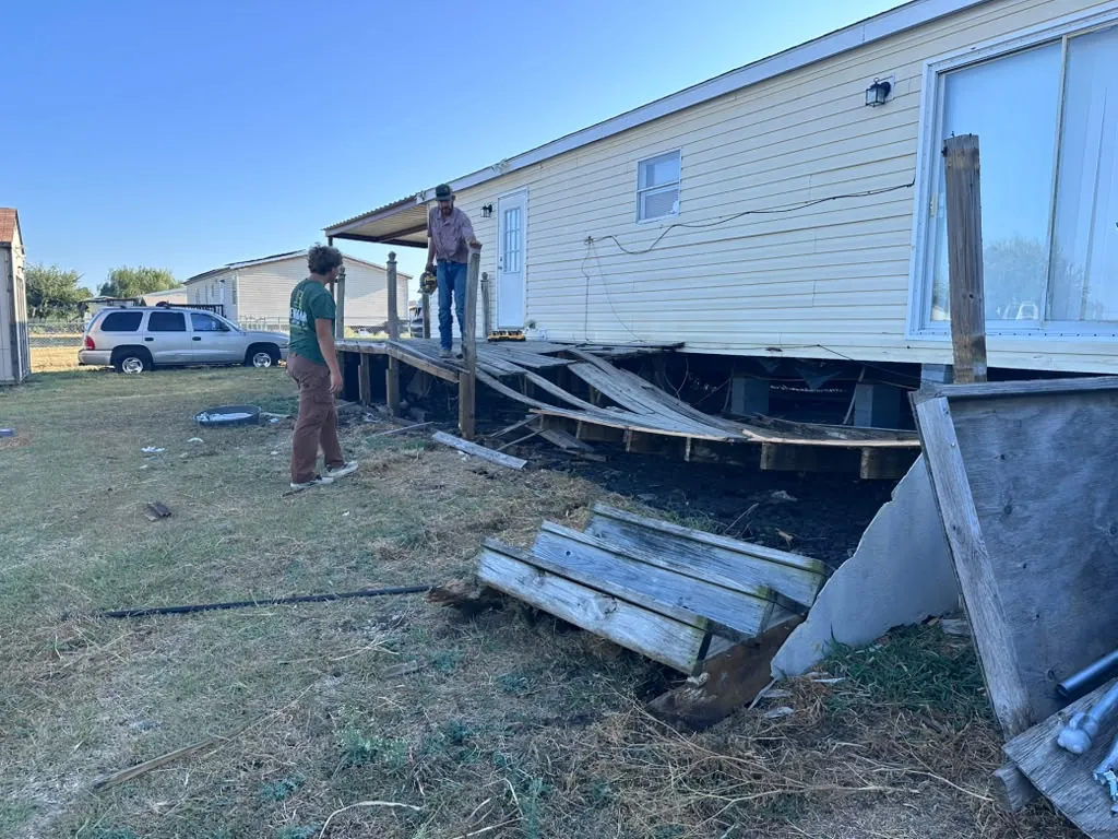 BenchMark Decks crew tearing out the old deck framing in Joshua, TX
