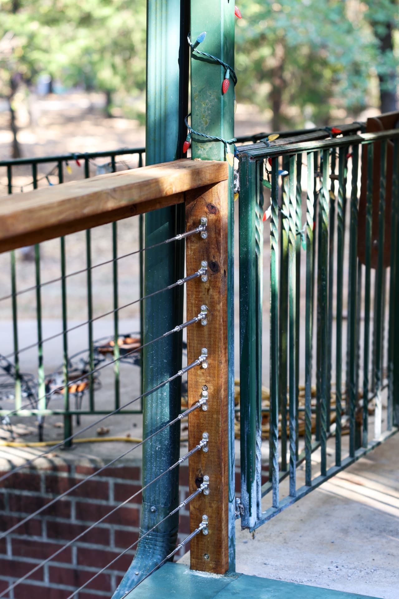 Cable railing tied into the existing covered patio columns