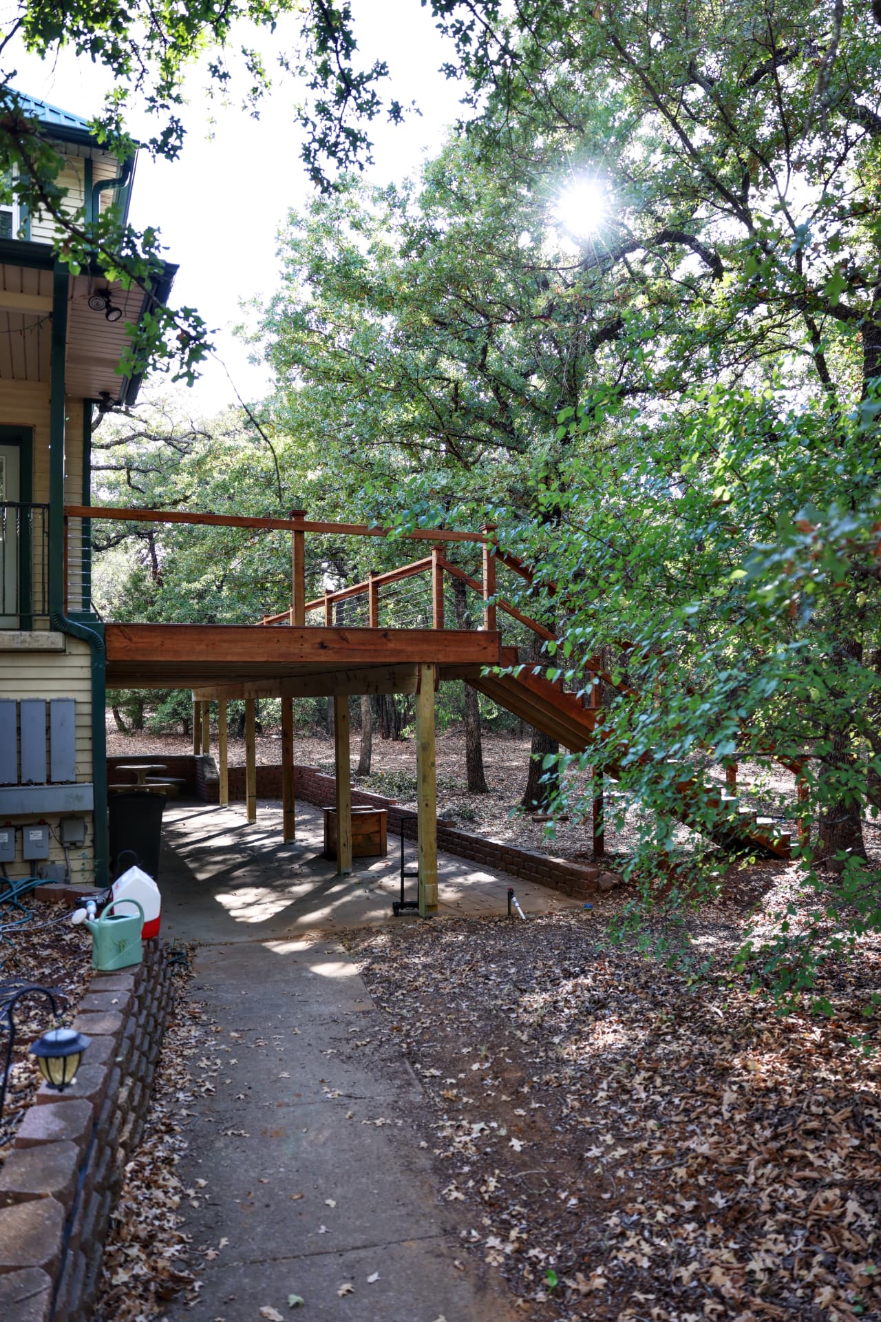 Underside of the elevated deck creating a covered patio in Grandview, TX