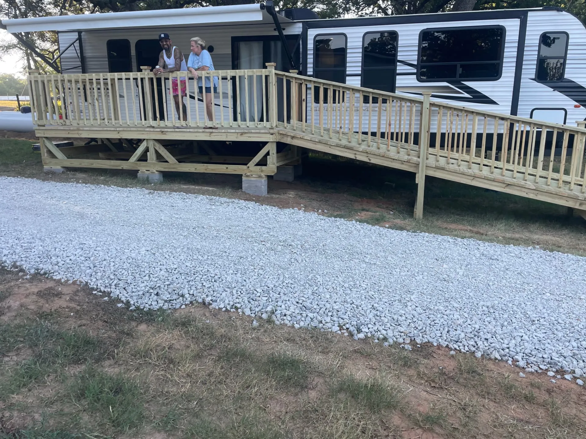 8x16 RV deck with 4x20 ramp and railing, built by BenchMark Decks in Weatherford, Texas