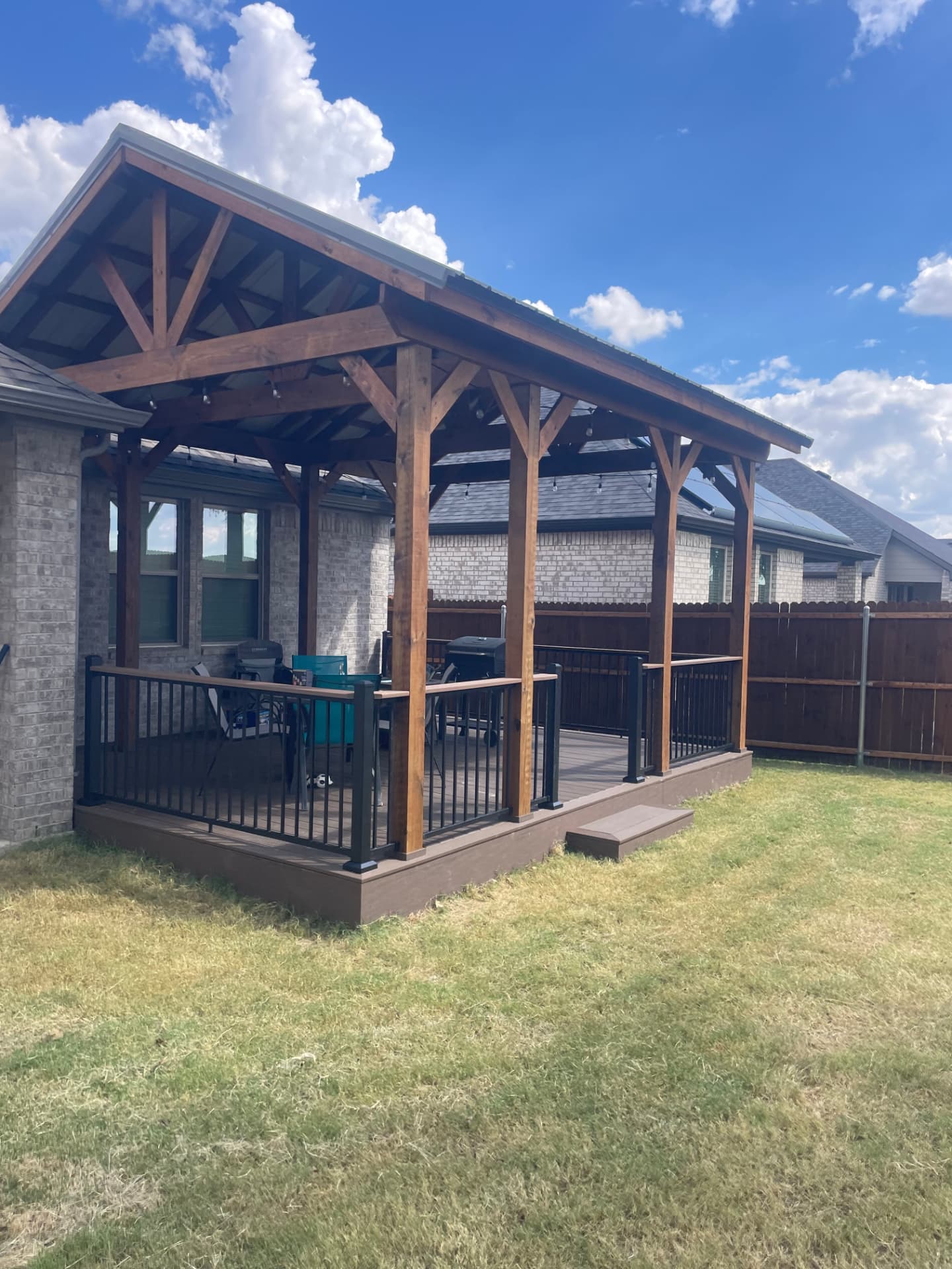 Completed covered composite deck with timber pavilion in Alvarado, TX