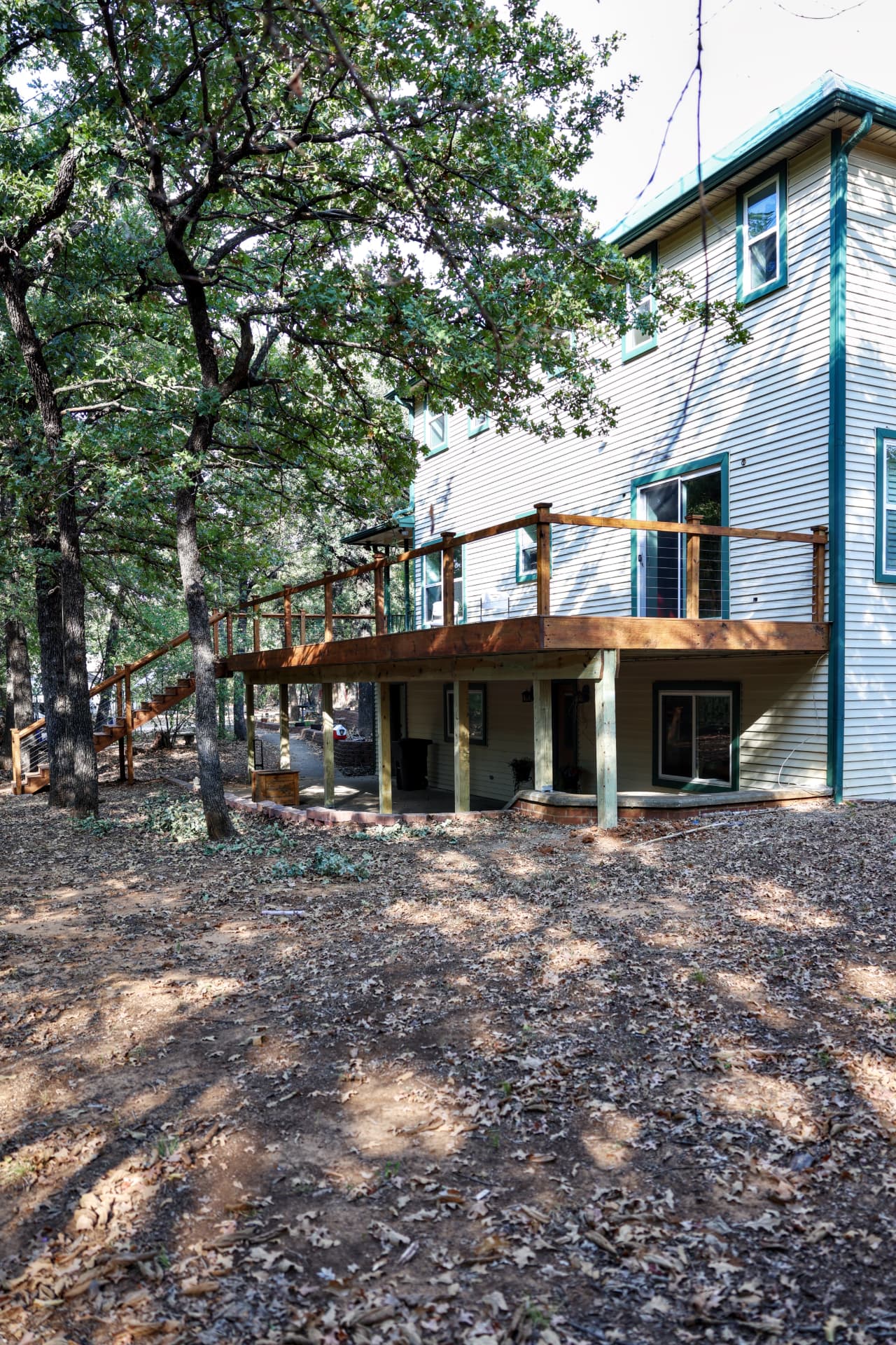 Wide view of the finished elevated deck and stairs in Grandview, TX