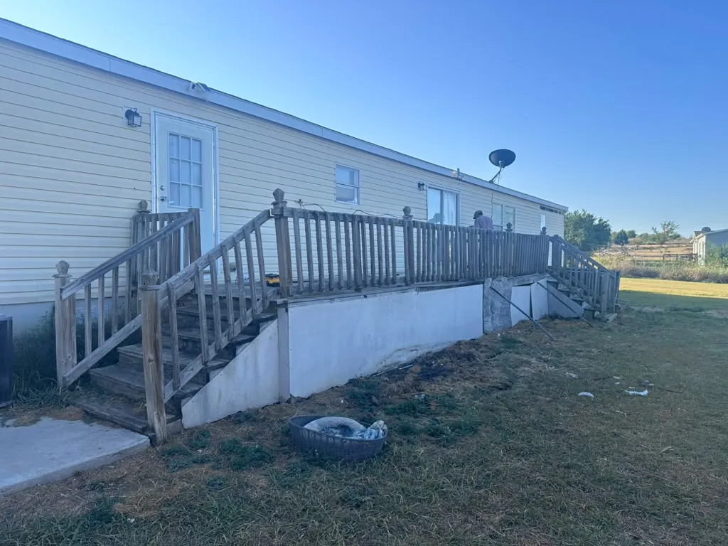 Violet's old weathered wood deck and stairs before teardown in Joshua, TX