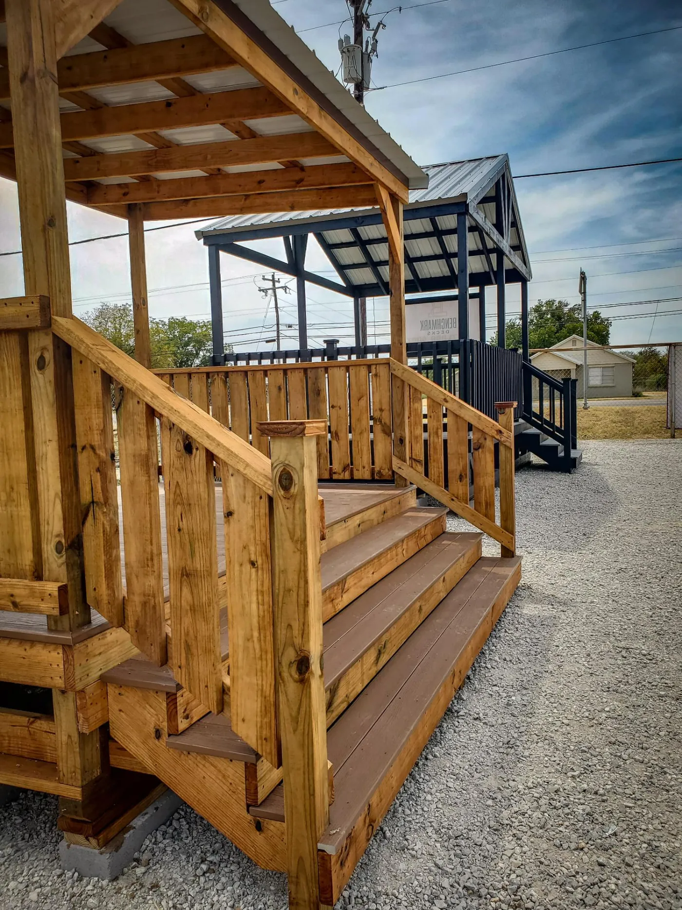 Composite deck display model with cedar railing and pergola cover