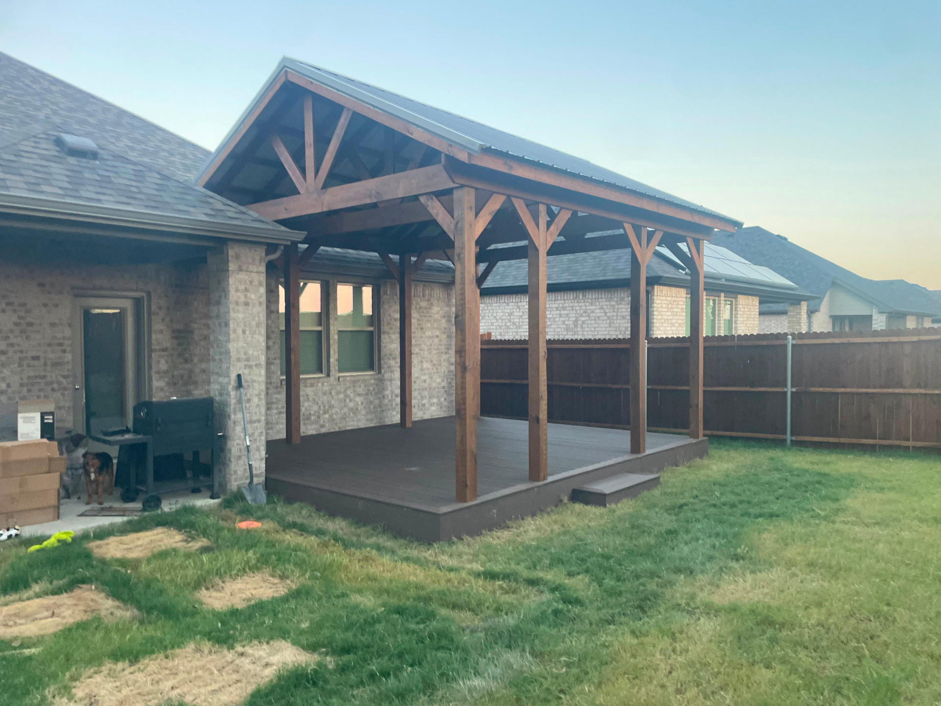 Finished covered composite deck with timber gable pavilion in Alvarado, TX