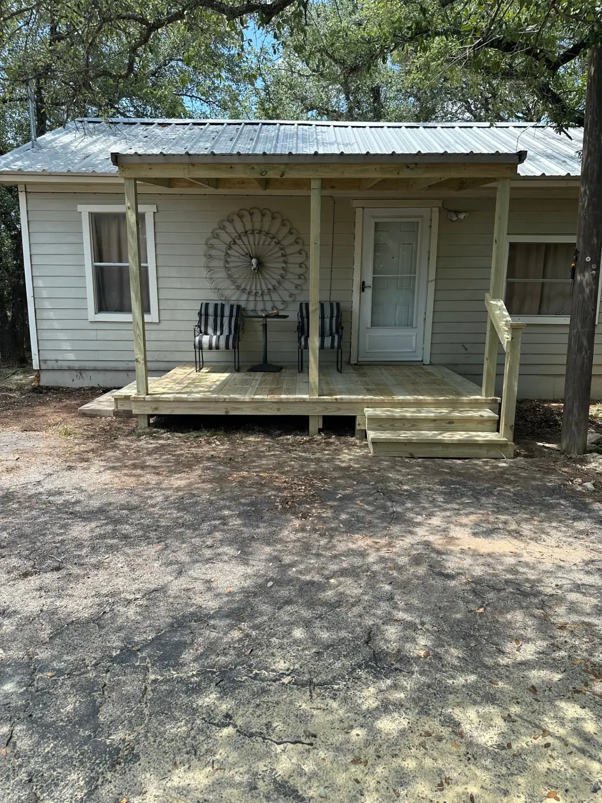 Covered front porch deck with metal roof on a manufactured home