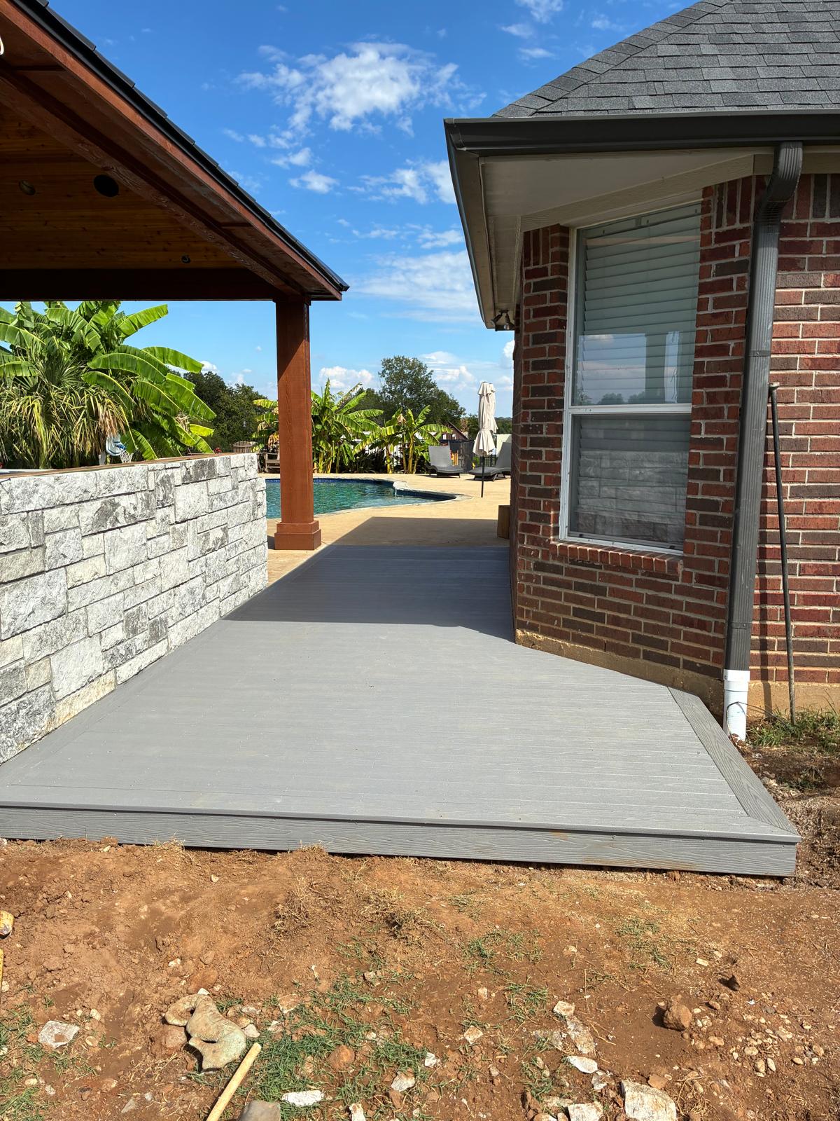 Chase's Low-Profile Poolside Composite Deck in Joshua, TX