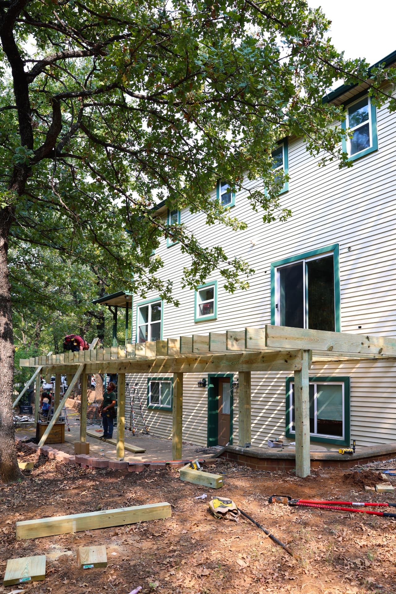Deck beams and posts installed along the back wall of the house in Grandview, TX
