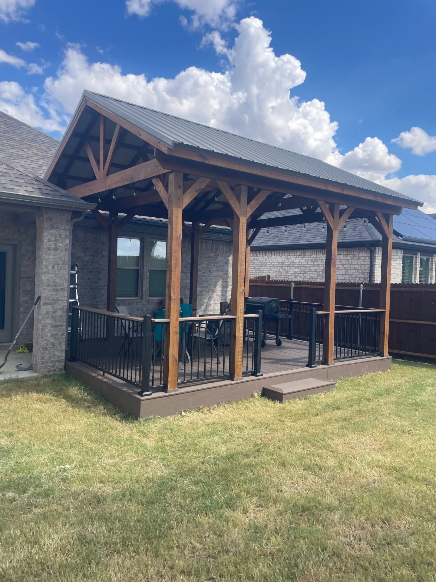 Finished timber pavilion with metal roof over composite deck