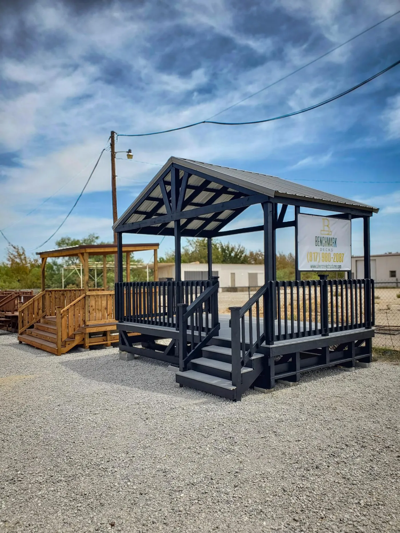 Black covered deck with composite decking and metal roof