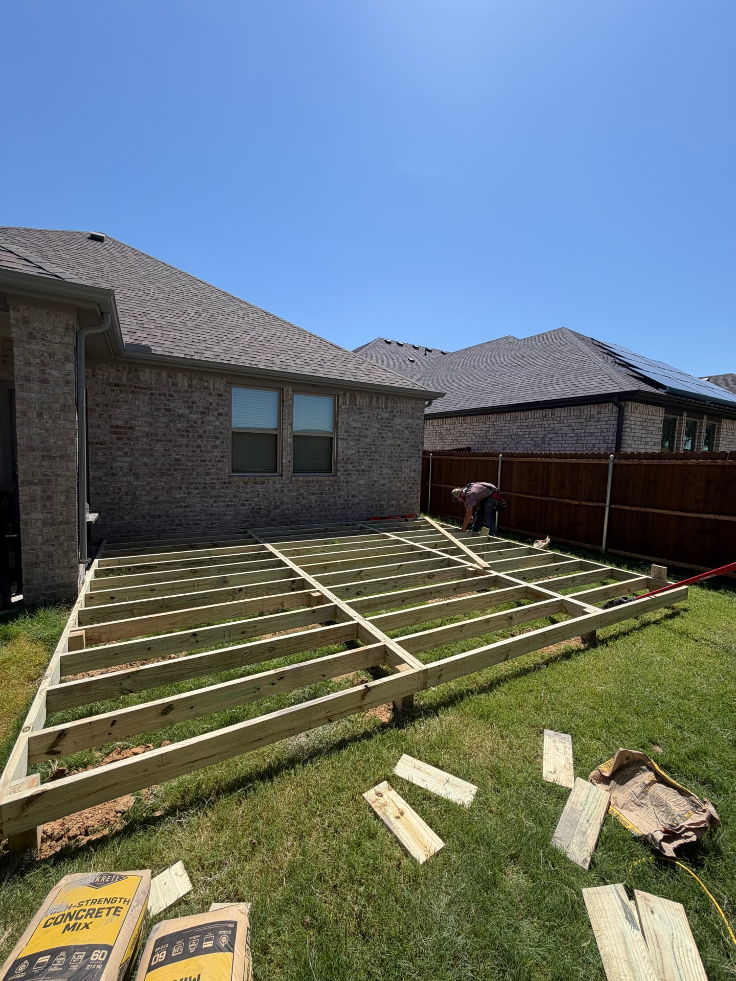 Pressure treated deck framing laid out in Keith's backyard