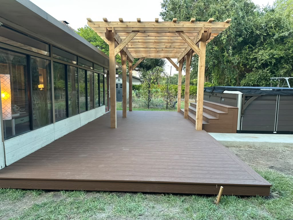 Finished Cabin composite deck with cedar pergola along the back of Danny's house