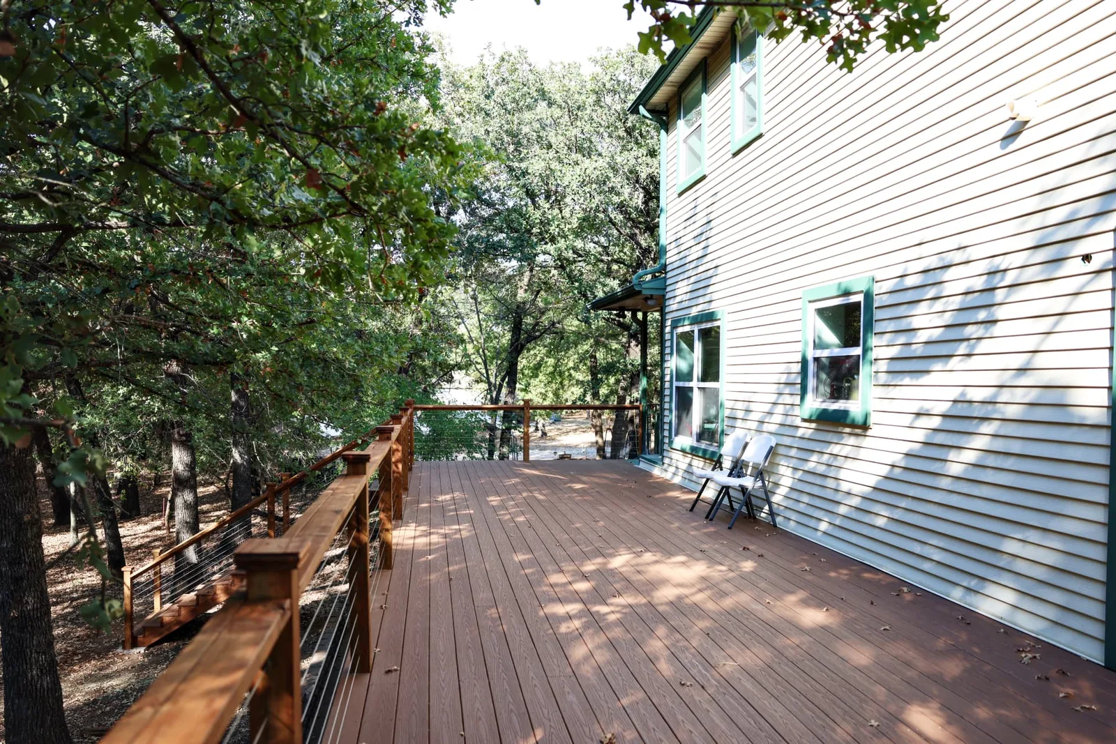 Finished Fiberon Good Life composite decking in Cabin with cable railing