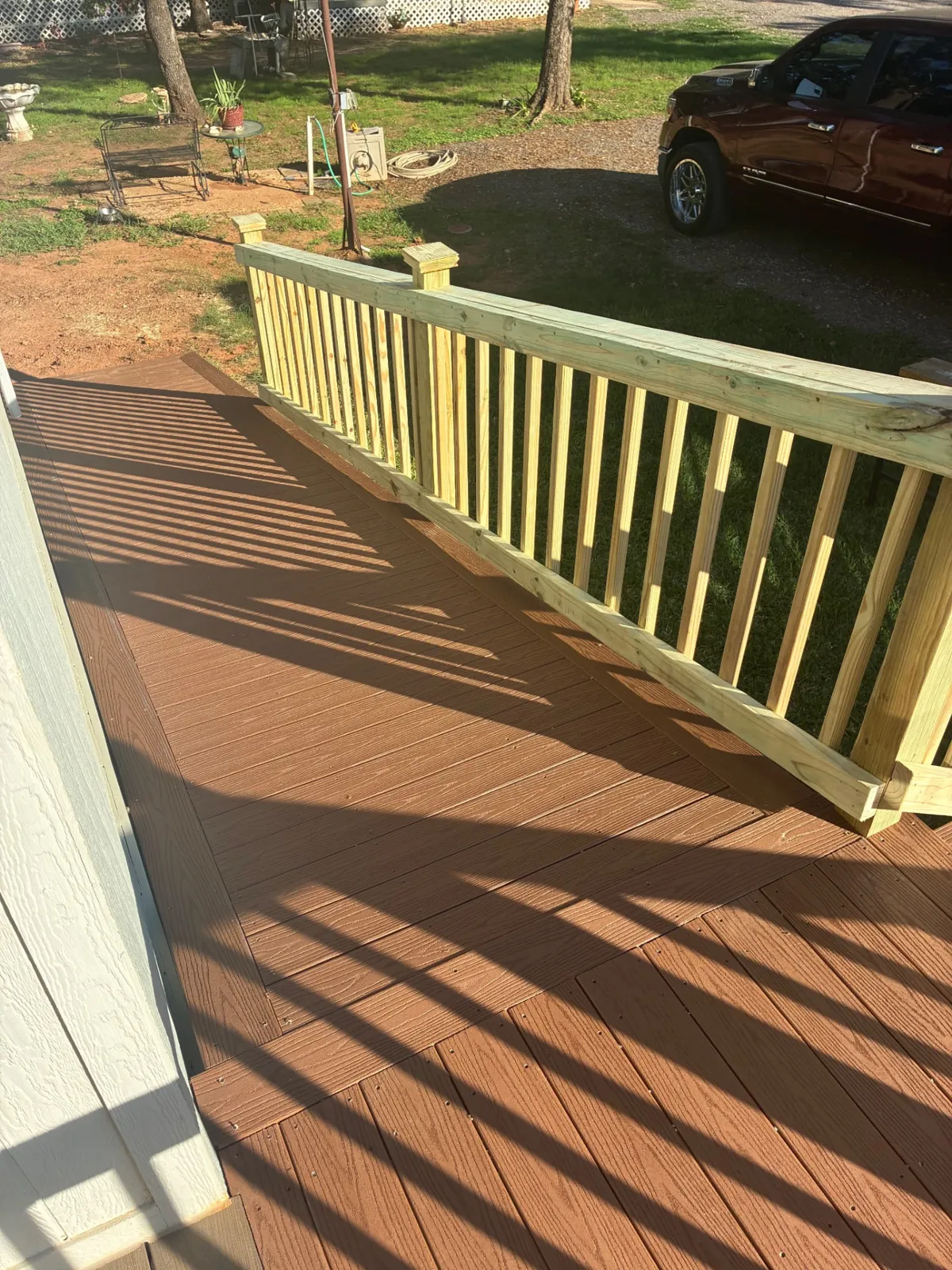 4x4 Fiberon Cabin composite landing and 4x20 ramp with treated wood railing, built by BenchMark Decks in Fort Worth, Texas