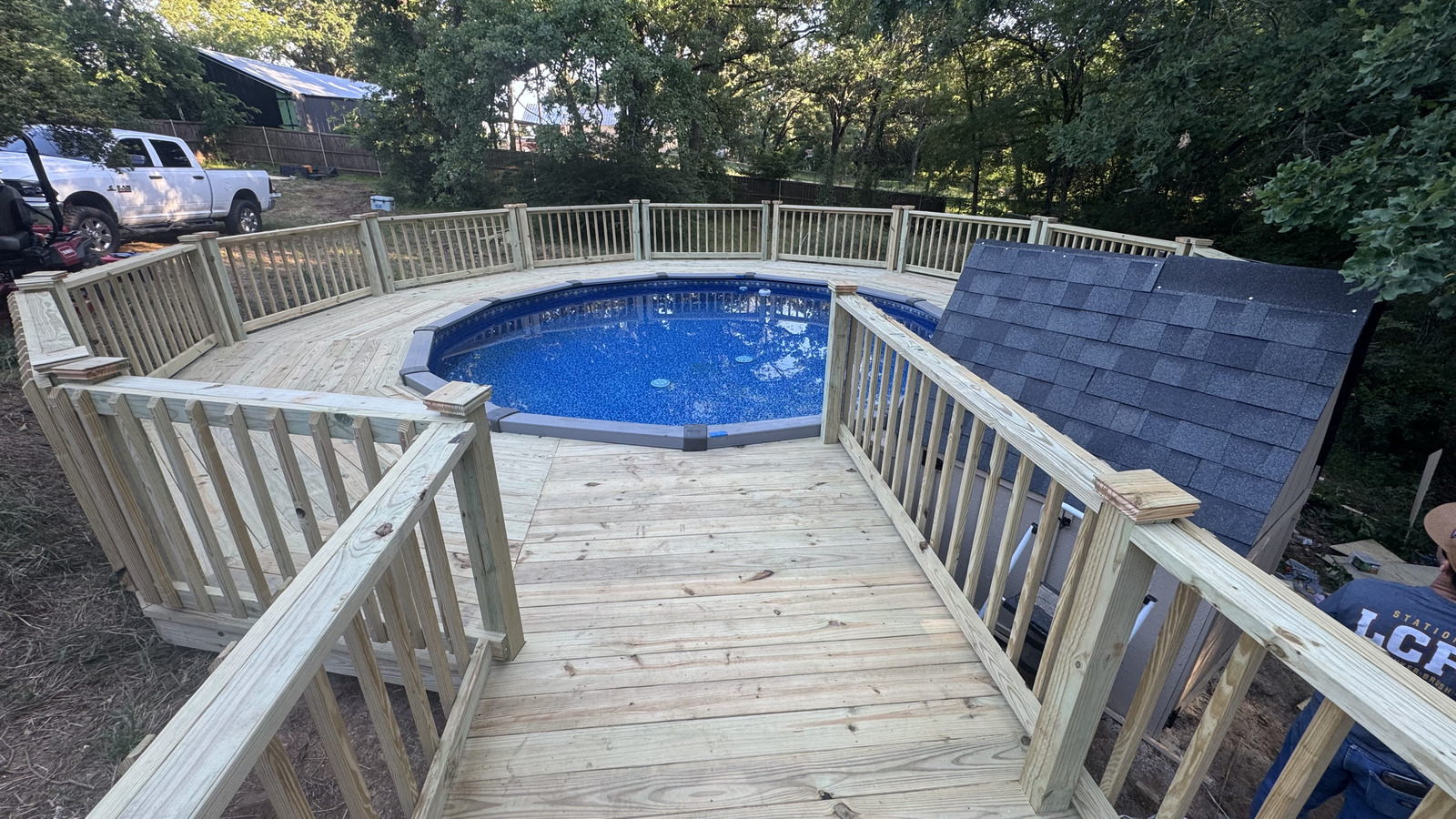 Custom pine deck with railing built by BenchMark Decks